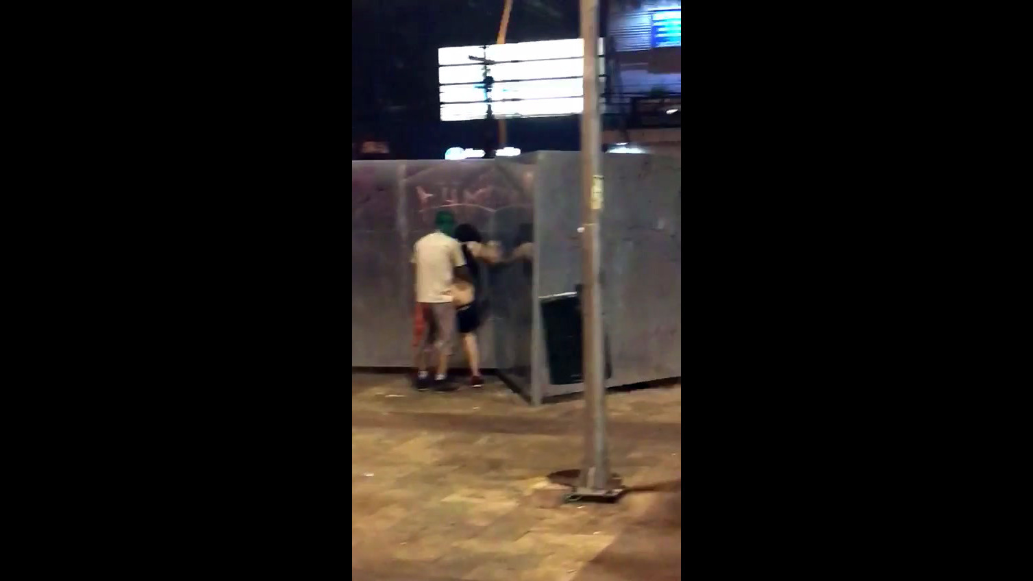 Public standing penetrating filmed by