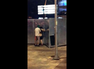 Public standing penetrating filmed by